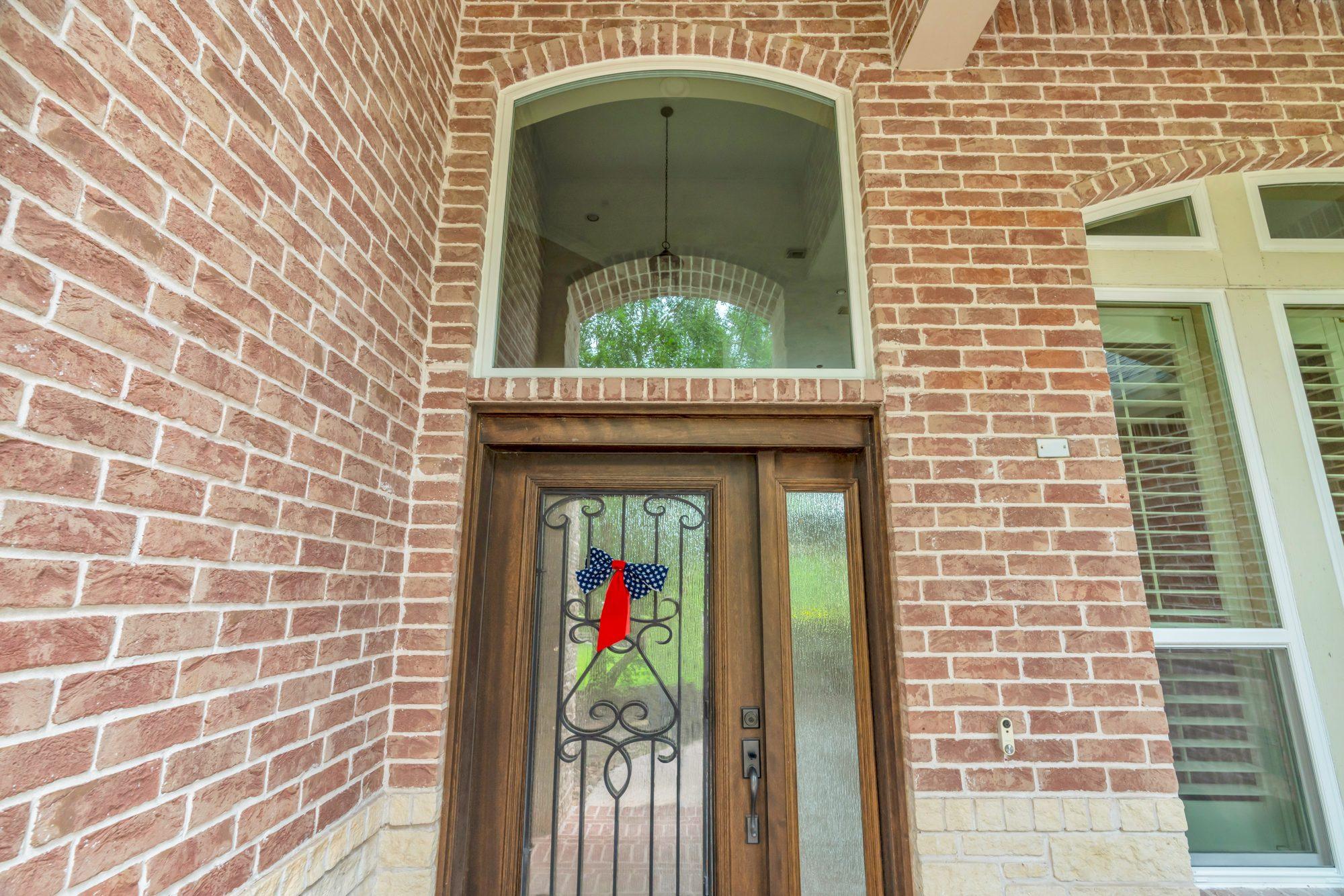 Allstate Windows & Siding project — door entry wood iron