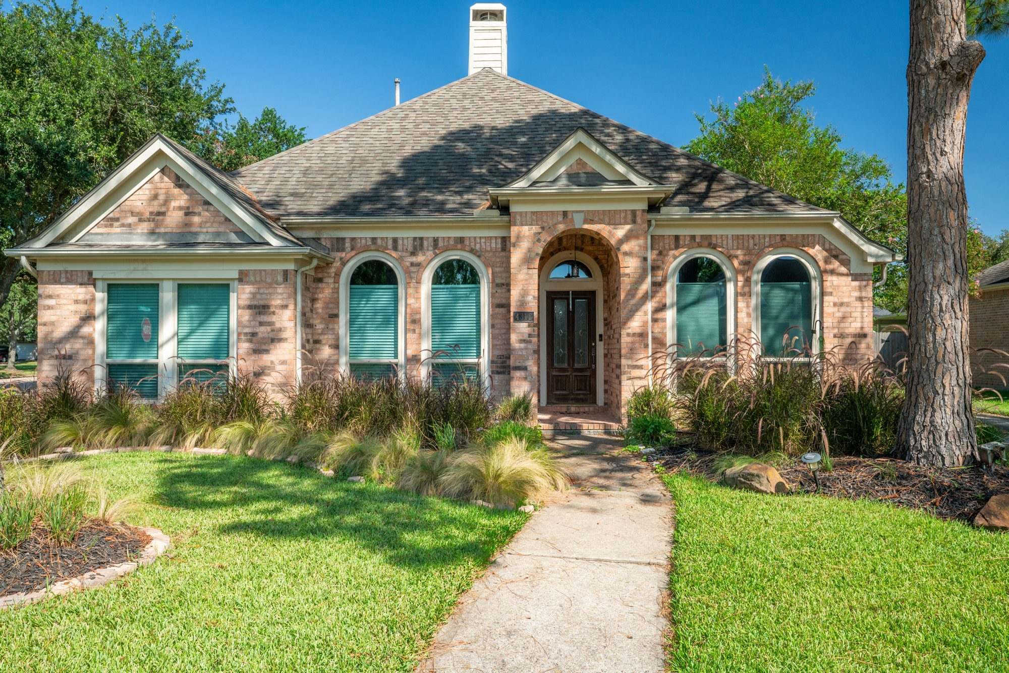 Allstate Windows & Siding project — hero exterior brick home
