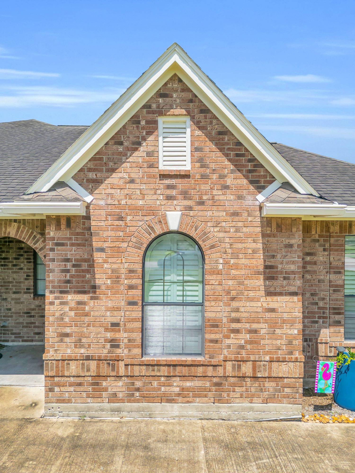 Before — Arched window replacement — custom-fit units that keep the home's character.