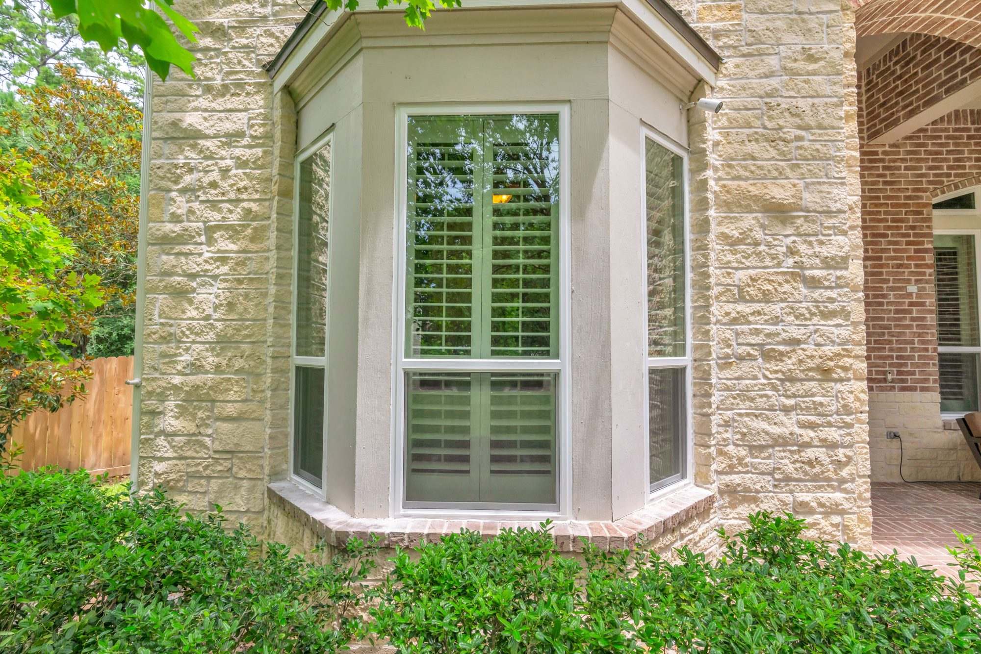 New bay windows on a stone-front Houston home