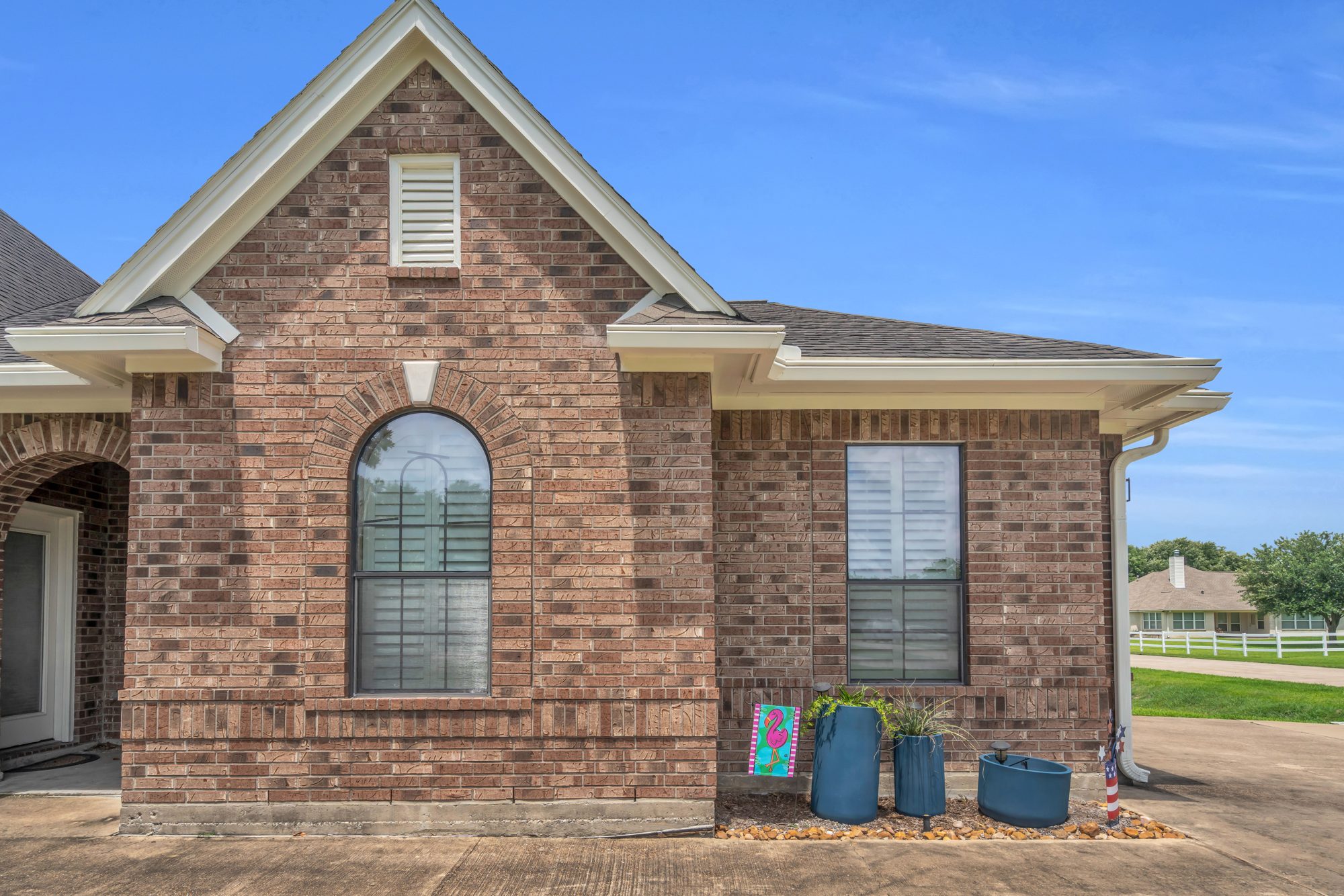 Before — Full window replacement — Ravensway home, brick exterior refreshed with new energy-efficient units.